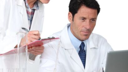 lab assistants on computer